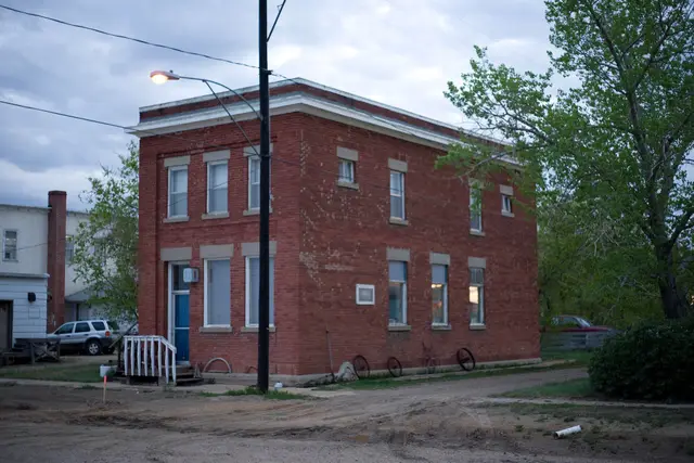 Old brick building on a dirt street
