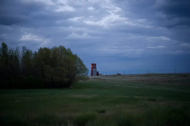 Grain elevator on the prairie at dusk